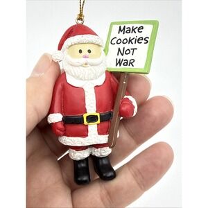 Make Cookies Not War Christmas Ornament - Our Name Is Mud Santa Activist 3" Tall